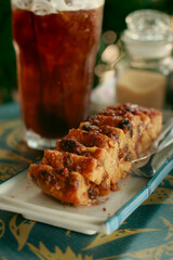 Vertical shot of a pineapple pudding cake at a cozy cafe, autumn season theme