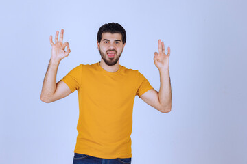 Man showing enjoyment and ok hand sign