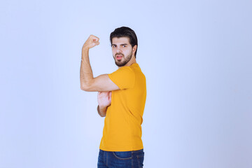 Man showing his arm muscles and feels powerful