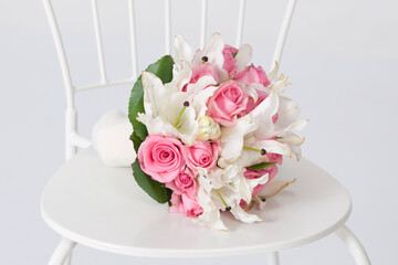 pink and white roses on a chair