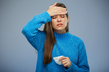 Sick woman with fever touching her forehead. isolated portrait female person with eyes closed.