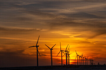 Clean energy windmills at Sunset