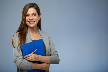 Smiling woman teacher holding blue clipboard and ready administer exam. Isolated portrait.