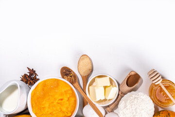 Set of pumpkin pie ingredients - pumpkin puree, spices, cinnamon, dough ingredients, floue, eggs, butter, cream milk, copy space