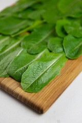 fresh romaine lettuce leaves on wooden table