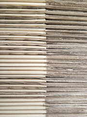 Closeup of the cardboard pile for containing the textbooks.