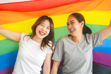 Portrait of happy smile southeast asian woman lgbt couple with rainbow pride flag