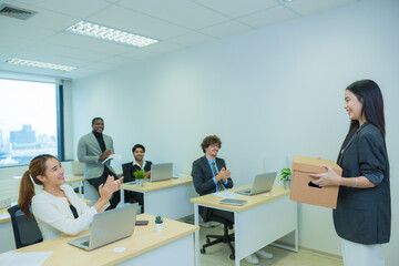 New colleague is coming into the office. Asian woman coming to the office in first time and greeting by her colleague.