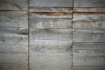 Background, texture wall decorated with small pieces of old weathered boards