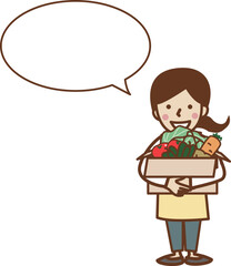 段ボールに入った野菜を抱え持つエプロン姿の笑顔の女性。コピースペース。