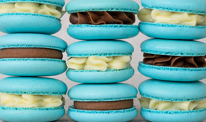 Traditional french blue macarons close up background. blue macarons with different fillings
