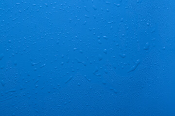 Water drops on blue color  surface