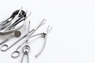 Stack of surgical medical steel equipment at surgery desk