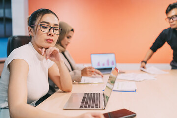 bored asian beautiful business woman in meeting. an exhausted female employee tired of boring...