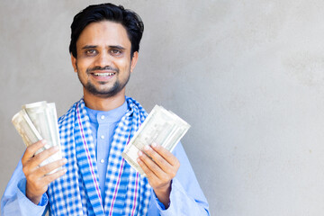 Young indian farmer businessman counting money. Farmer holding money in hand