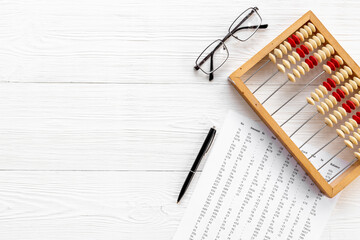 Vintage accounting wooden abacus. Financial calculations concept