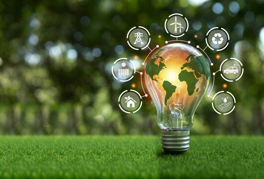 The green world map is on a light bulb that represents green energy Renewable energy that is important to the world. Renewable Energy.Environmental protection, renewable, sustainable energy sources.