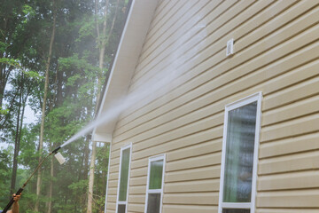 Cleaning maintenance service for washing siding house and maintaining the home a high-pressure...
