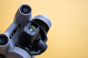 Close-up of gimbal and camera of drone on light background