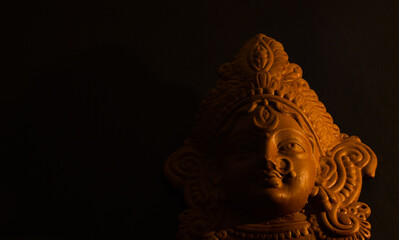 terracotta sculpture of face of goddess Durga for Durga Puja festival in west bengal india. shot...