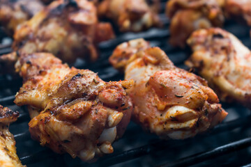 Marinated raw meat just put on the barbecue, chicken and ribs