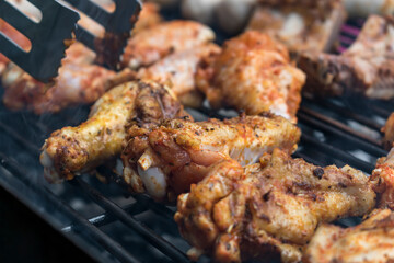 Marinated raw meat just put on the barbecue, chicken and ribs