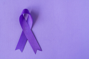 World Cancer Day. International Overdose Awareness Day. The purple ribbon on the purple background