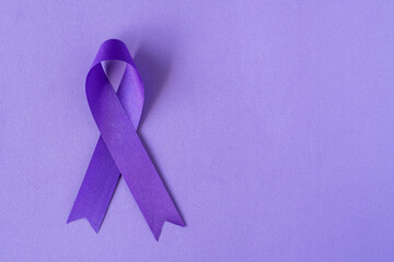 World Cancer Day. International Overdose Awareness Day. The pink ribbon, purple ribbon on the...