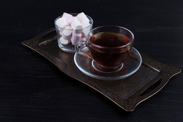 White marshmallows with a cup of tea