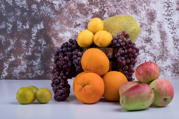 Summer fruits mix on a marble background