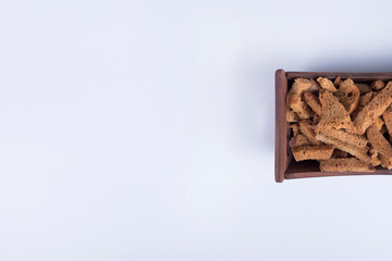 Bread crackers in a wooden tray on right side