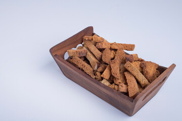 Bread crackers in a wooden tray, angle view