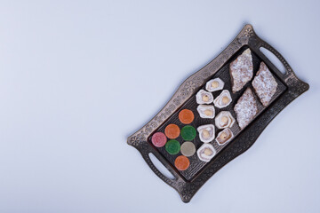 Pastry board with marmelades, delights and nuts