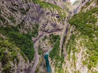 The purest waters of the turquoise color of the river Moraca flowing among the canyons. Travel around Montenegro concept Portrait of a disgruntled girl sitting at a cafe table