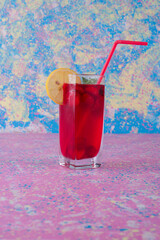 Strawberry smoothie served with lemon