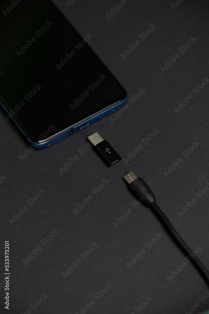 Poster phone with usb type c and micro usb to type c adapter and cable.