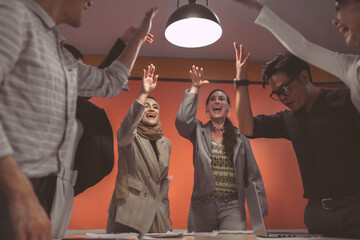 Celebrate of success team for business community teamwork. Cheerful International business company team start conference, work in a workplace. Office employee team project smile in a convention room