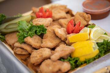 Fried Fillet of Chicken Meat with Lemon and Vegetable. Delicious  Schnitzel for Snack.