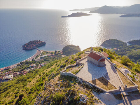 The Church of St. Sava in Montenegro, near the island of Sveti Stefan near Budwa. Drone view. Location: church St. Sava, Montenegro, Balkans, Adriatic sea, Europe Portrait of a disgruntled girl