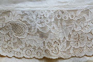 Antique lace family heirloom christening gown - 1930. Close up of the lace hem and delicate material.