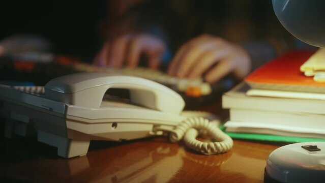 Close-up of person typing on computer keyboard in retro office, writer lifestyle