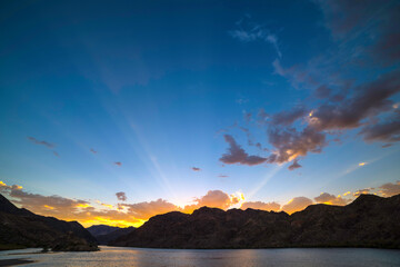 Sunset with sunray  over Colorado River near Las Vegas
