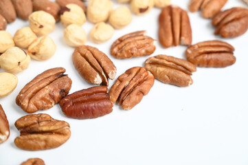 Pecan nut and other nut isolated on white background with copy space.