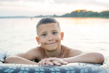 Rest on vacation. Bathing. Child at Lake Myastro
