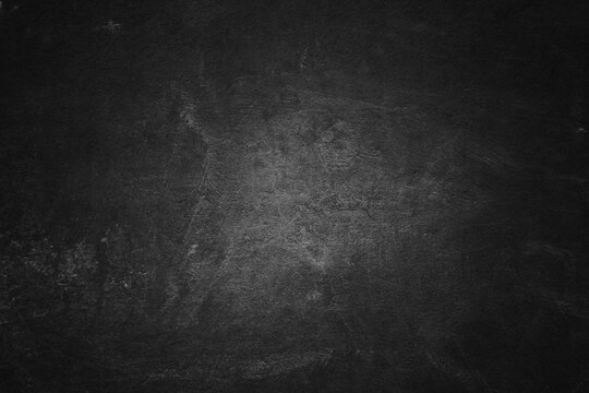 OLd black concrete wall. Grunge background