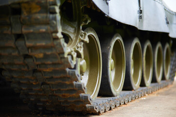 Caterpillars of a military tank close up detail
