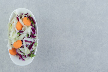 Mixed vegetables in bowl , on the marble background