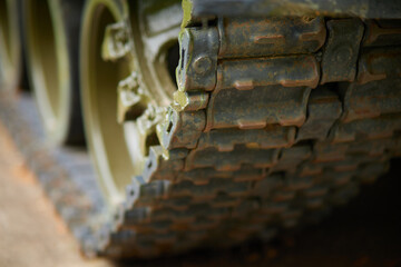 Caterpillars of a military tank close up detail
