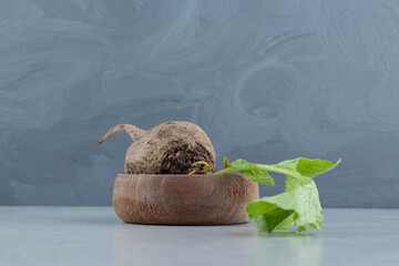A small bowl of radish , on the marble background