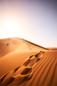 Walking in the Sahara Desert (Morocco Chegaga desert) © Feroz